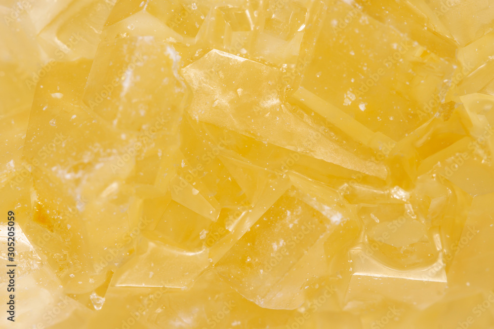Fruit juice crystal yellow background pattern texture macro Fruit juice crystal yellow background pattern texture macro