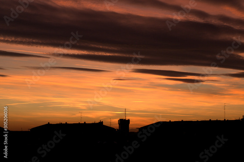 sunset in the city,silhouette,evening,clouds,skyline,panorama,orange,