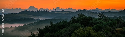 Beautiful Tuscany scenery with rolling hills at sunrise