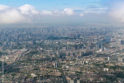 Aerial view of Bangkok city from airplane window.
