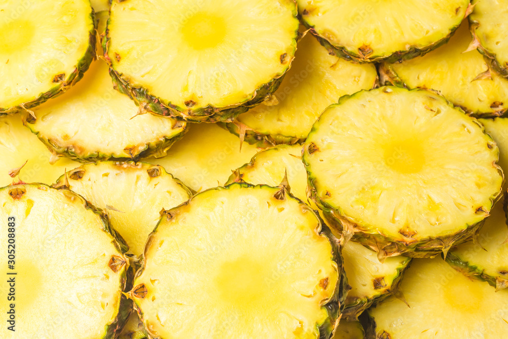 Pineapple juicy yellow slices background. Top view. Pineapple juicy yellow slices background. Top view.
