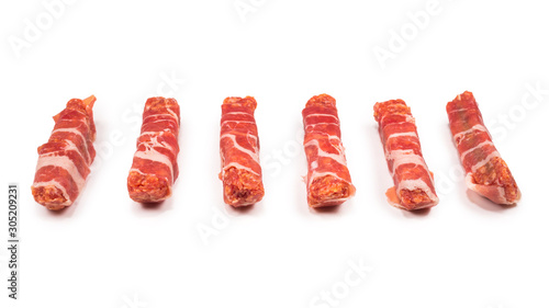 Chevapchichi in bacon isolated on white background. photo