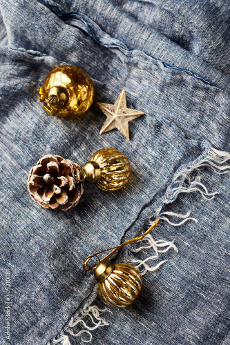 Christmas golden baubles on blue background. Copy space. 