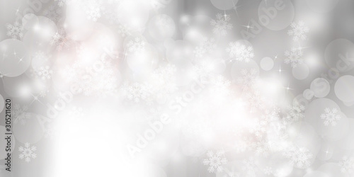 white and gray Christmas light with snowflake bokeh background, Winter backdrop wallpaper. © ooddysmile