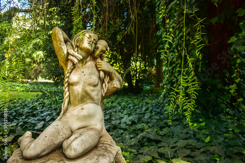 statue of woman in garden