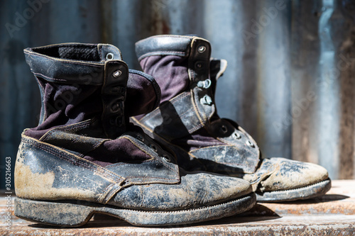 Canvas Print boots are torn. Removing the floor Old iron wall backdrop