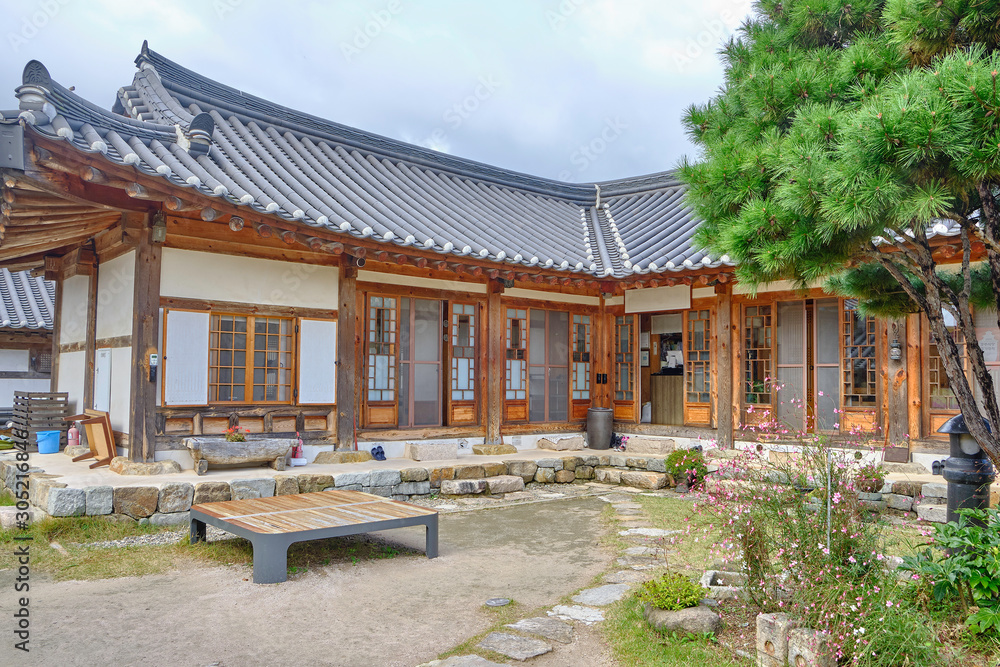 Scenic view of traditional korean building in village on bank of Hyeongsan River in Gyeongju in South Korea. Beautiful summer cloudy look of colorful asian style house in Republic of Korea.