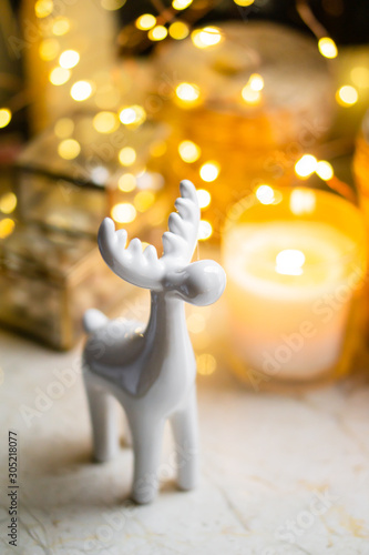 Little white ceramic Christmas deer figurine with yellow holiday lights