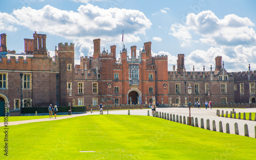 London, UK. English architecture Tudors time, West Front of Hampton court with entrance gate, locates in West London