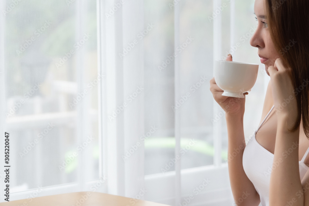 Lazy woman drinking morning coffee at home. Lazy woman drinking morning coffee at home.