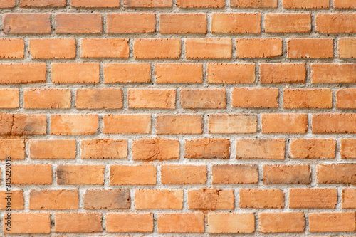 Grunge old red brick pattern textured background.