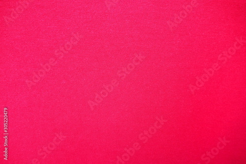 Closeup of beautiful and quality red and pink fabric with texture for textile, fashion beauty and simple background. Clothing and apparel concept.