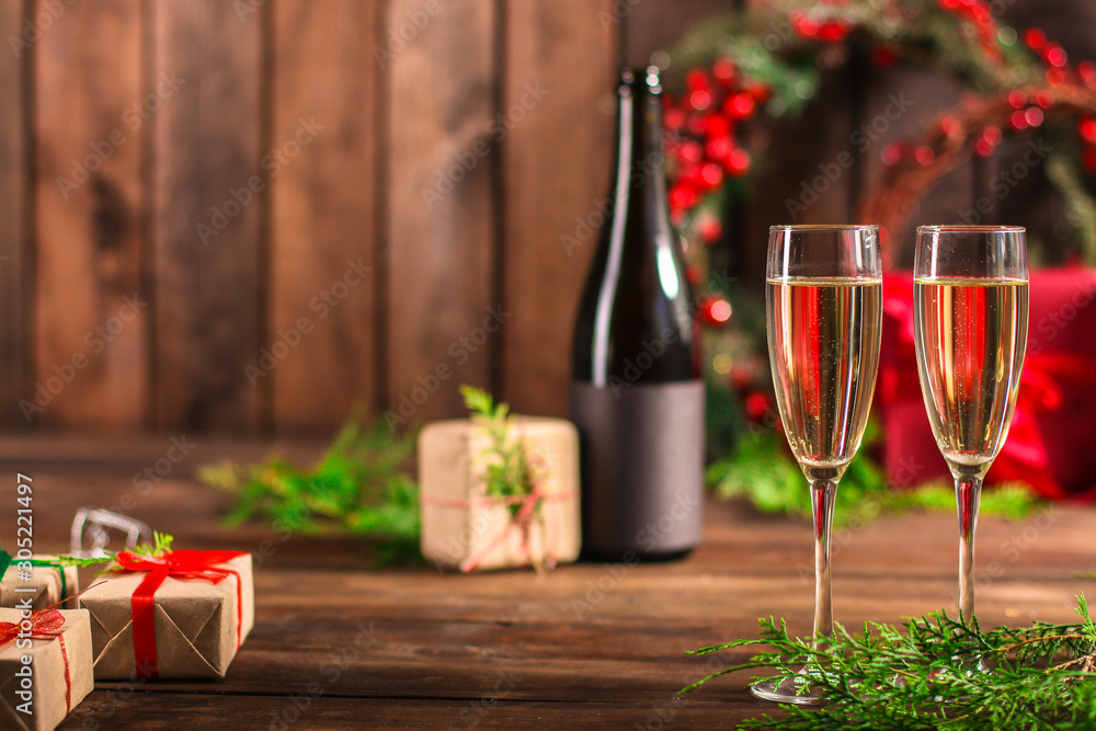 champagne and new year, christmas or noel (champagne glass, sparkling wine and gifts on the table) menu concept. food background. copy space. Top view
