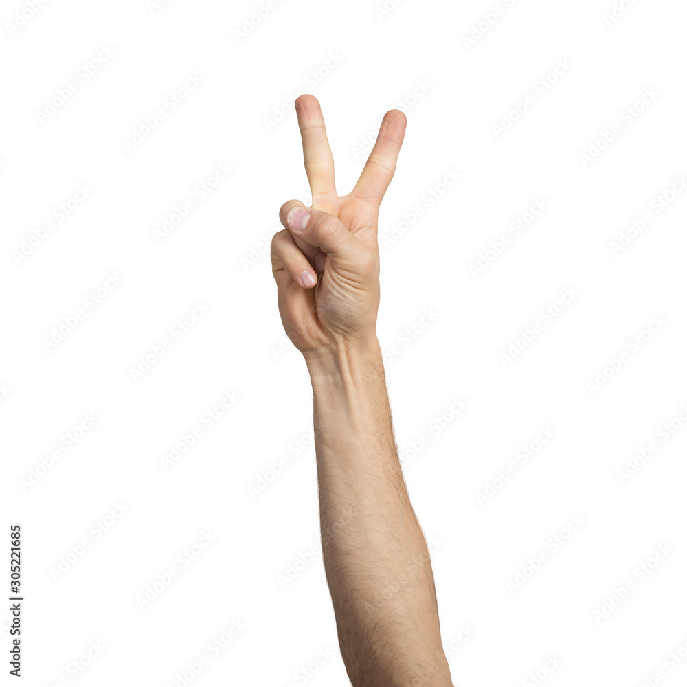 Adult man hand showing victory gesture Adult man hand showing victory gesture