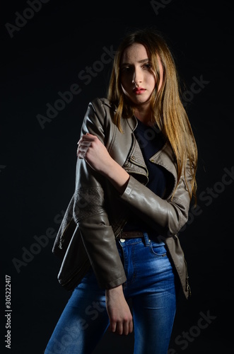 beautiful brunette in the studio on a black background