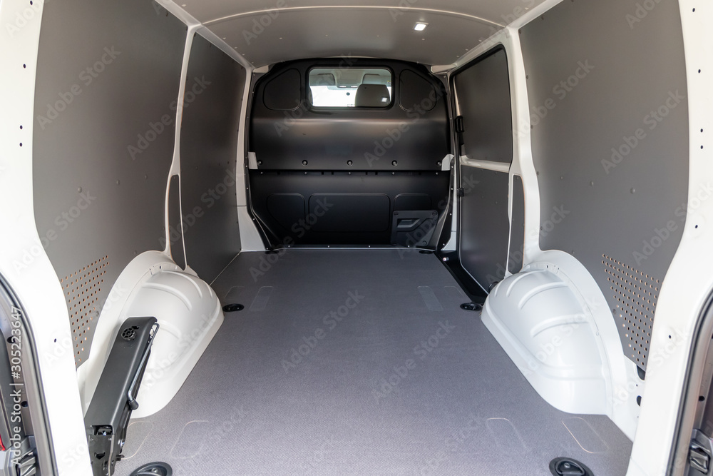 Fototapeta premium Empty freight compartment of a van. Clean empty cargo van.