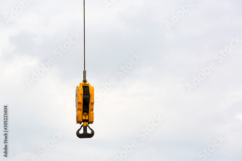 Work part with crane hook against the sky. photo