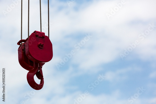 Work part with crane hook against the sky. photo