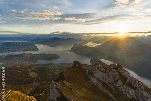 Beautiful sunrise panoramic view on Swiss Alps around Lake Lucerne as seen from top of Pilatus Kulm peak © Tobias