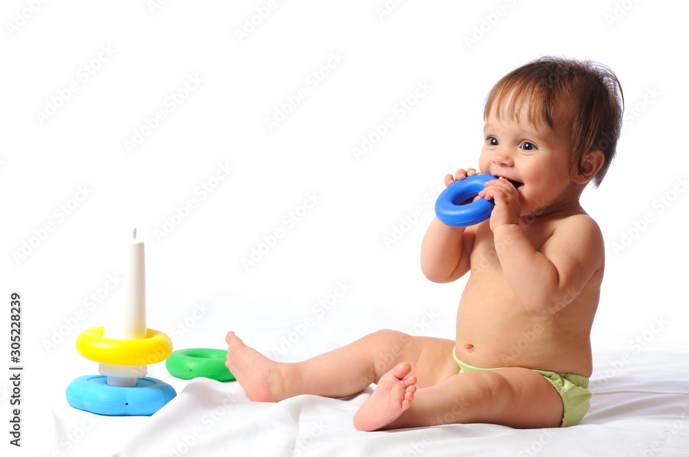 Happy little child rejoice at pyramid toy Happy little child rejoice at pyramid toy