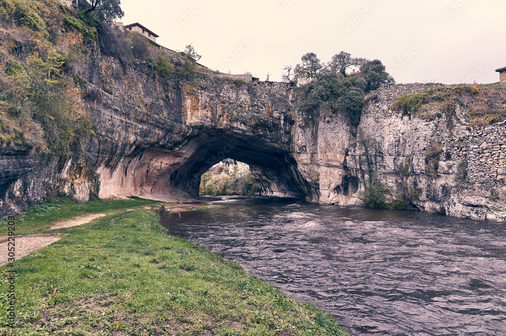 Natural rock bridge over the river Nela in Puentedey, Burgos, Spain.