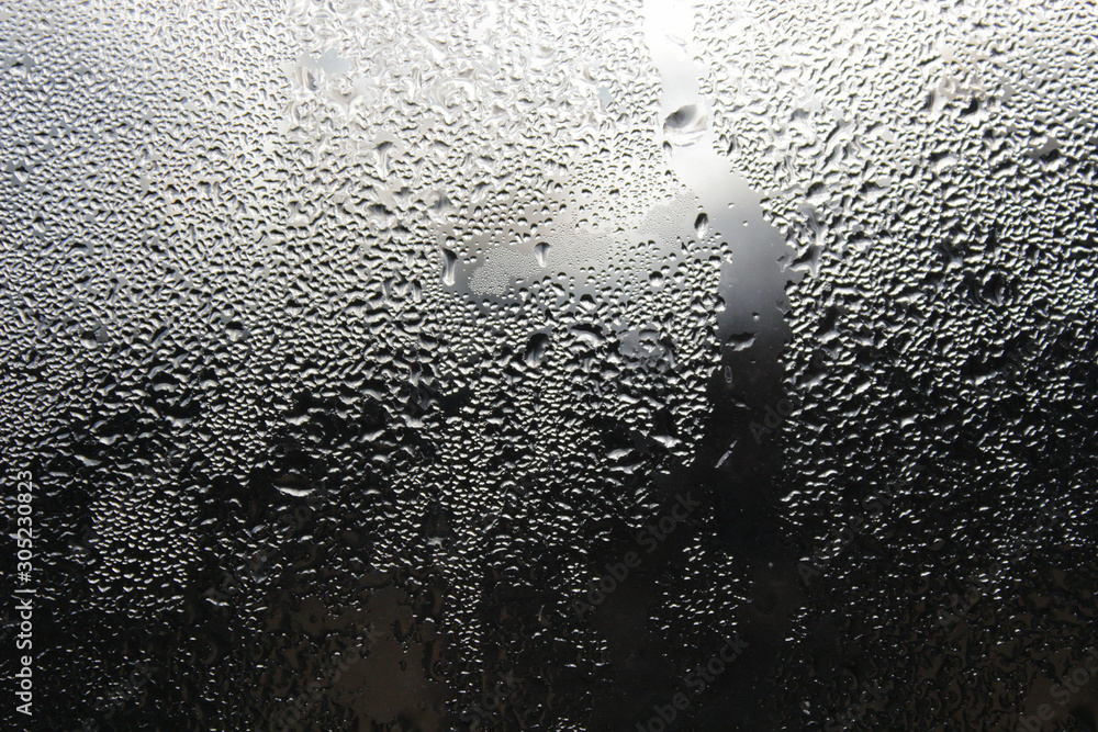 Condensation of water on misted glass. Condensation of water on misted glass.