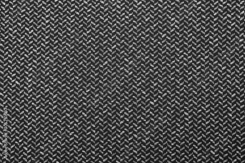 Gray wool pattern, textured salt and pepper style black and white melange upholstery. Fabric background copy space. Black and white herringbone