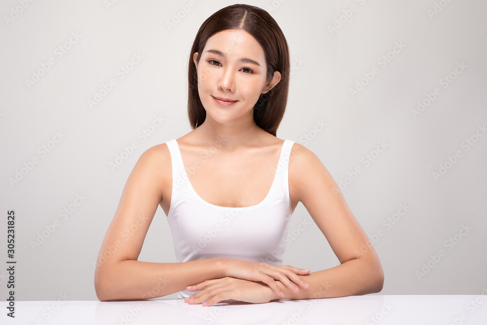 Beautiful Asian woman looking at camera smile with clean and fresh skin Happiness and cheerful with positive emotional,isolated on gray background,Beauty and Cosmetics Concept Beautiful Asian woman looking at camera smile with clean and fresh skin Happiness and cheerful with positive emotional,isolated on gray background,Beauty and Cosmetics Concept