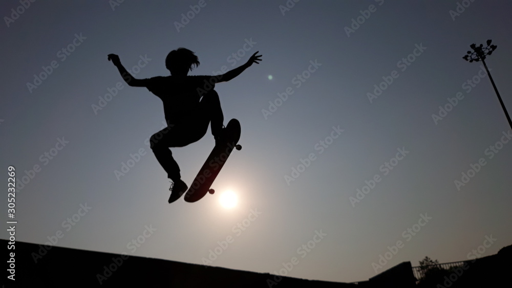 silhouette of man jumping on a background of blue sky silhouette of man jumping on a background of blue sky