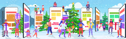 people in santa hats using mobile application mix race men women holding gift boxes online shopping concept christmas new year holidays celebration smartphone screen horizontal full length vector