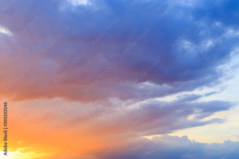 Fantasy abstract background, Gold sunlight on colorful sky and moving purple blue cloud before sunset
