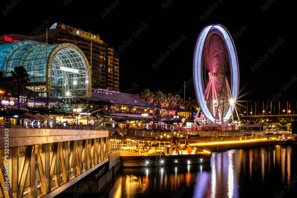 Extravagant lights of Sydney Darling Harbour and its Ferris Wheel