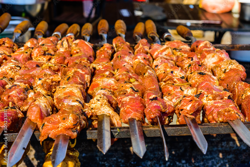 Skewers with meat over the charcoals. Cooking shashlik