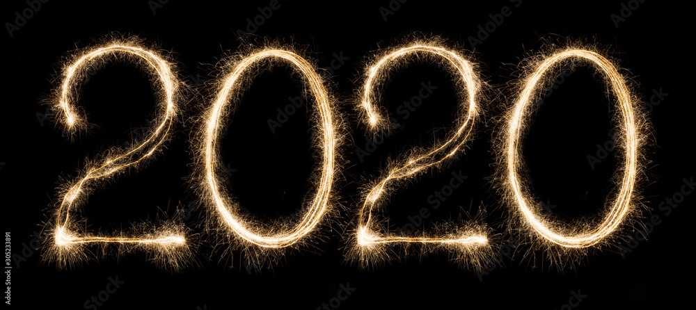 2020 written with sparkling holiday font on black background 2020 written with sparkling holiday font on black background
