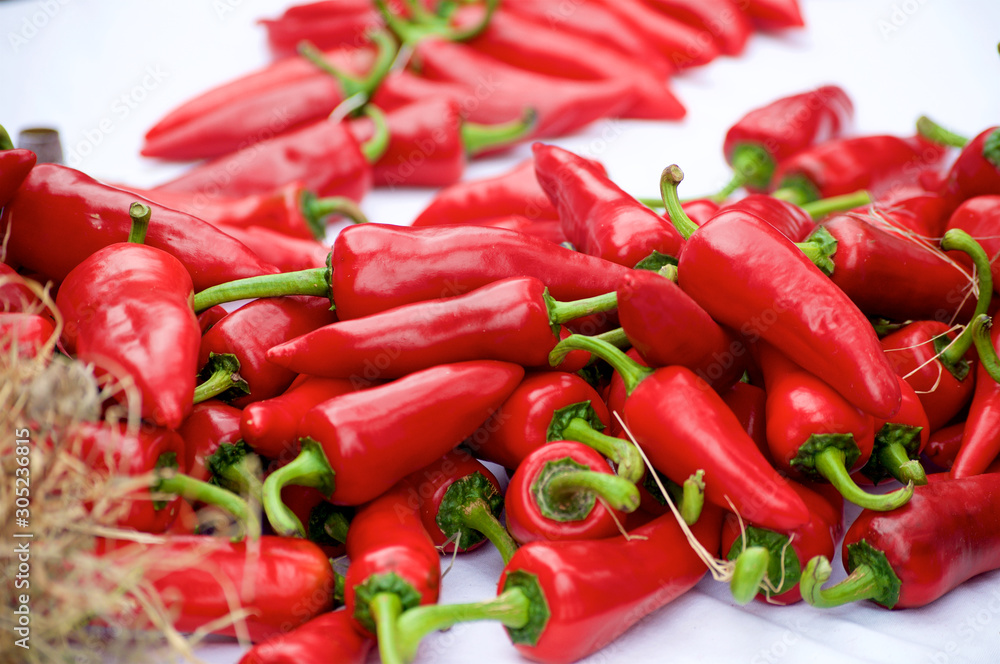 Feast of little red peppers iin a market in a small town in the South of France Feast of little red peppers iin a market in a small town in the South of France