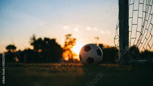 A ball for street soccer football under the sunset ray light. Film picture style. © nateejindakum