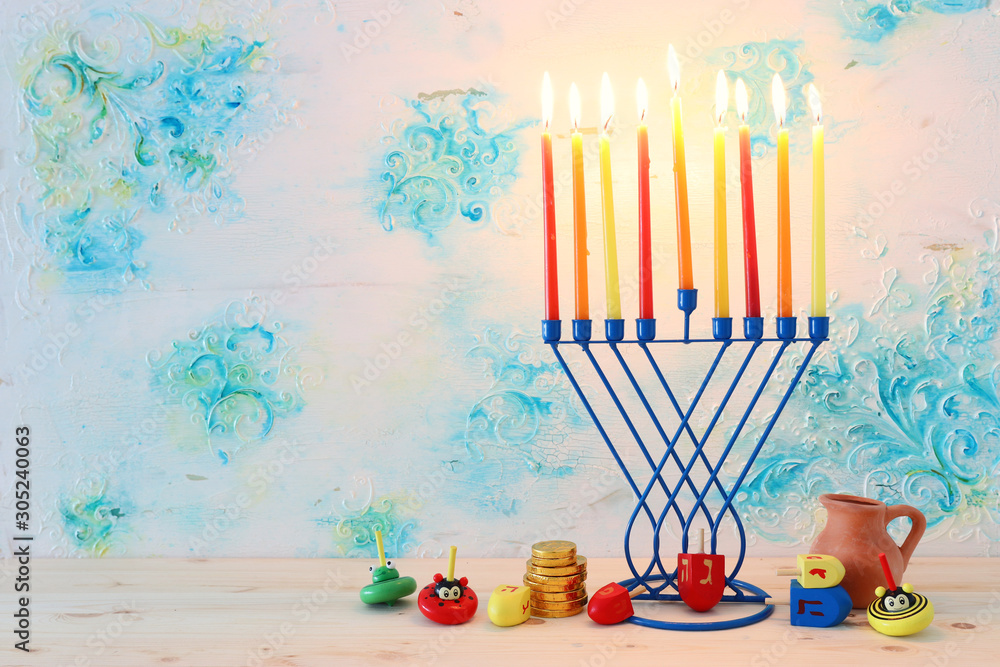 Religion image of jewish holiday Hanukkah background with menorah (traditional candelabra) and dreidels Religion image of jewish holiday Hanukkah background with menorah (traditional candelabra) and dreidels
