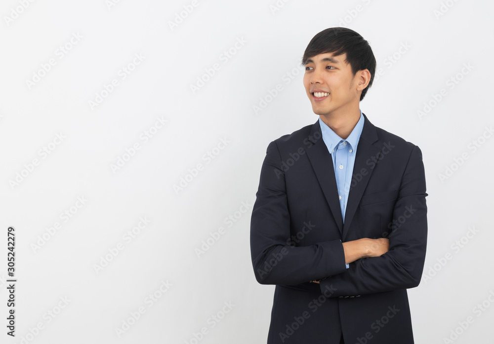 Young handsome asian man thinking an idea while looking up with arms crossed isolated on white background. Young handsome asian man thinking an idea while looking up with arms crossed isolated on white background.