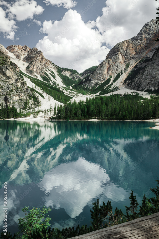 Beautiful reflection in the lake of Braies in a day of summer, during a trip in Trentino Alto Adige