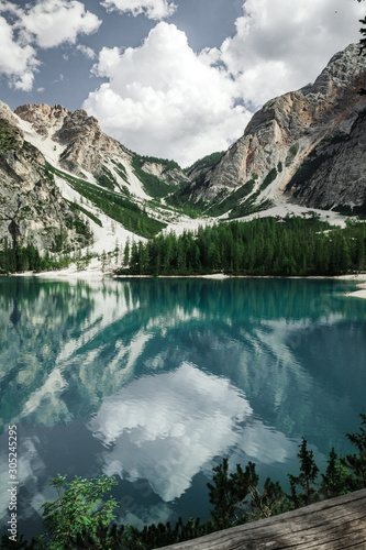 Beautiful reflection in the lake of Braies in a day of summer  during a trip in Trentino Alto Adige