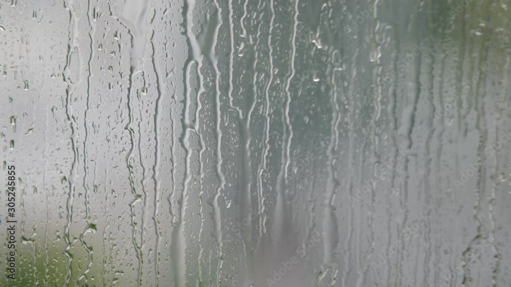 Close Up Rain Drops On A Window With Blurred Background Slow Motion 4k Close Up Rain Drops On A Window With Blurred Background Slow Motion 4k