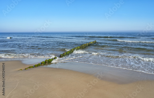 Baltic Sea - blue sky, wave sea and waterbreak.  photo