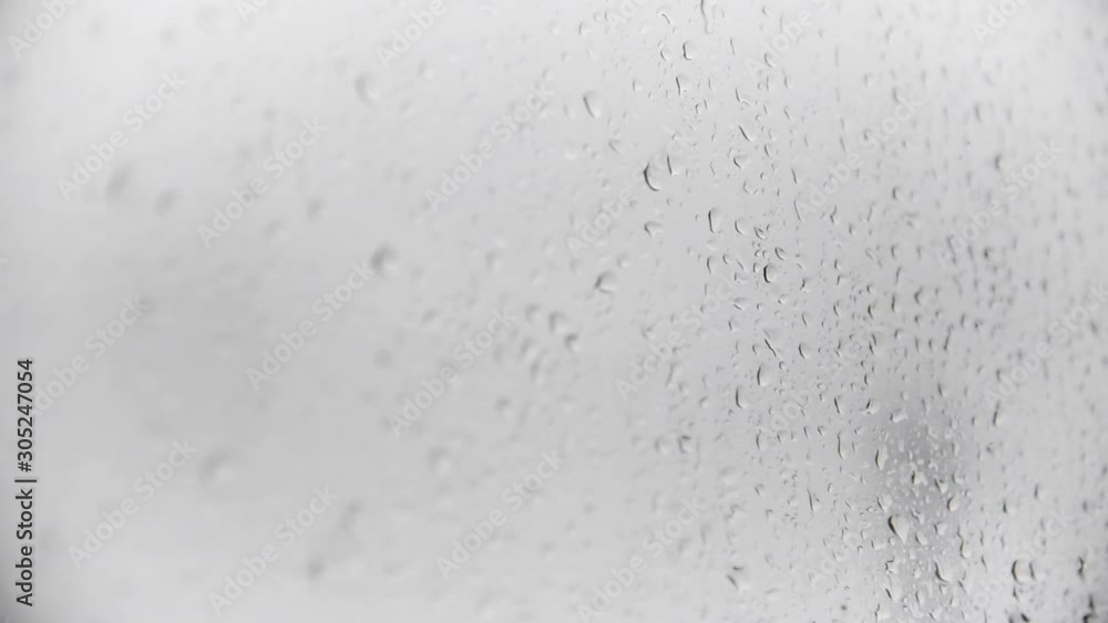 Close up of rain drops on the window, shallow depth of field. Close up of rain drops on the window, shallow depth of field.