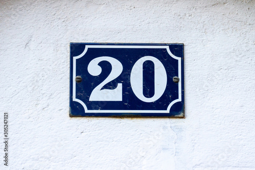 House number 20 on an enamel sign