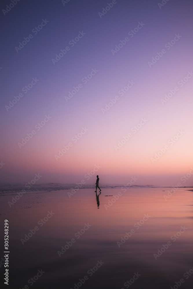 Man walking at sunset