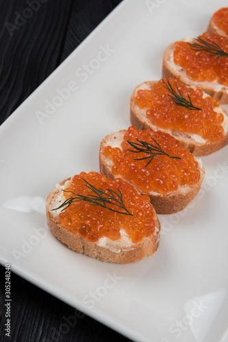 Sandwich with caviar and bu...