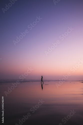 Man walking at sunset