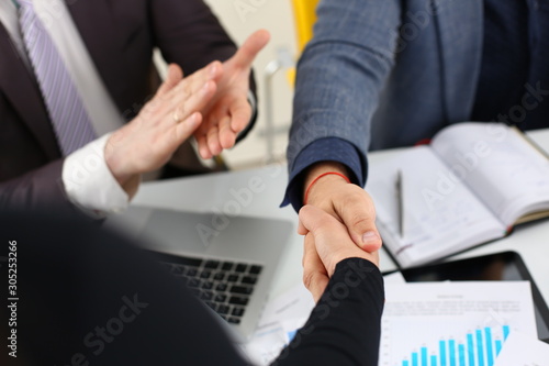 Billede på lærred young happy businessmen have meeting in office shake hands with each other