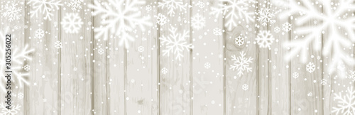 Christmas banner with white blurred snowflakes on wooden background. Merry Christmas and Happy New Year greeting banner. Horizontal new year background, headers, posters, cards, website. Vector 