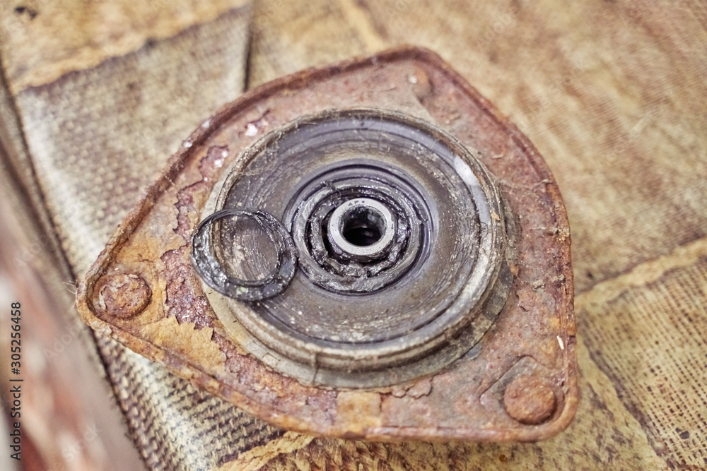 rusty broken buffer strut mounting of car mcpherson shock absorber, unsuitable for use. car repair, suspension parts. rusty broken buffer strut mounting of car mcpherson shock absorber, unsuitable for use. car repair, suspension parts.